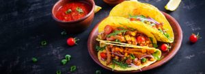 Taco. Mexican tacos with beef meat, corn and salsa. Mexican cuisine. Banner